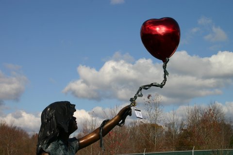 Girl with Heart Shaped Balloon